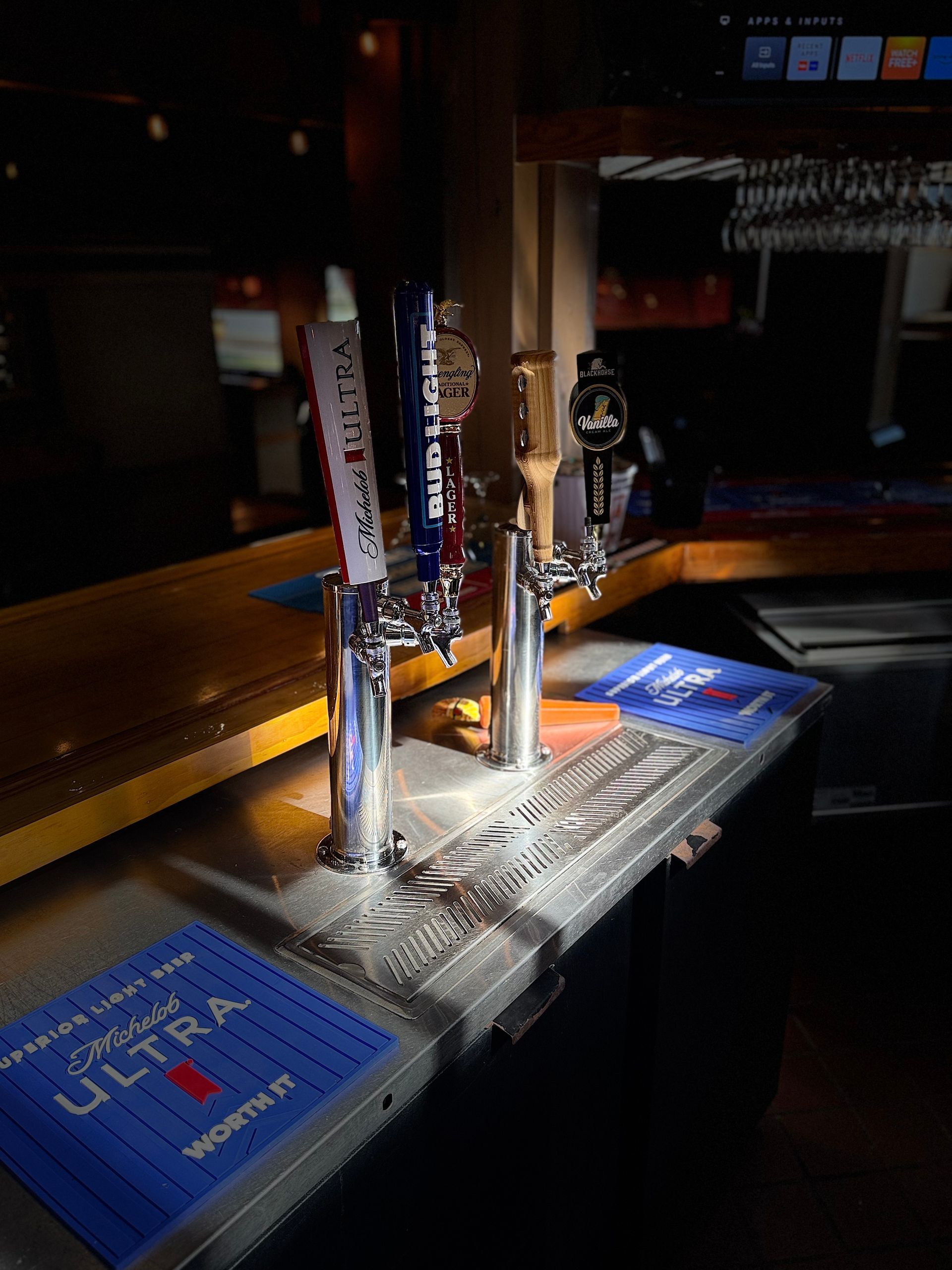 A bar with a blue mat that says ultra on it