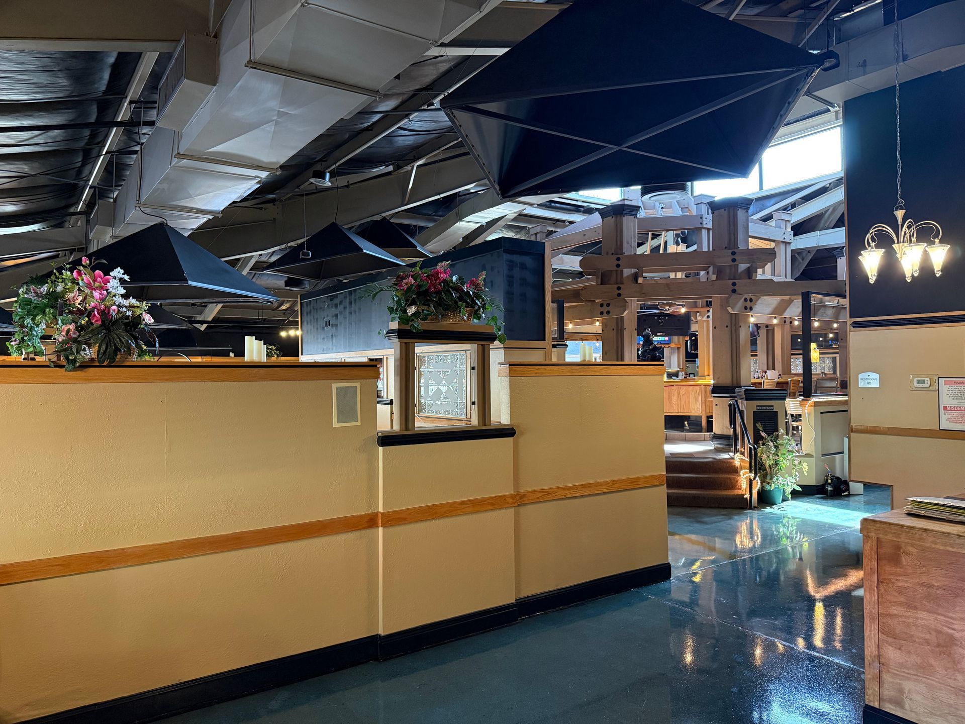 An empty restaurant with a clock on the wall