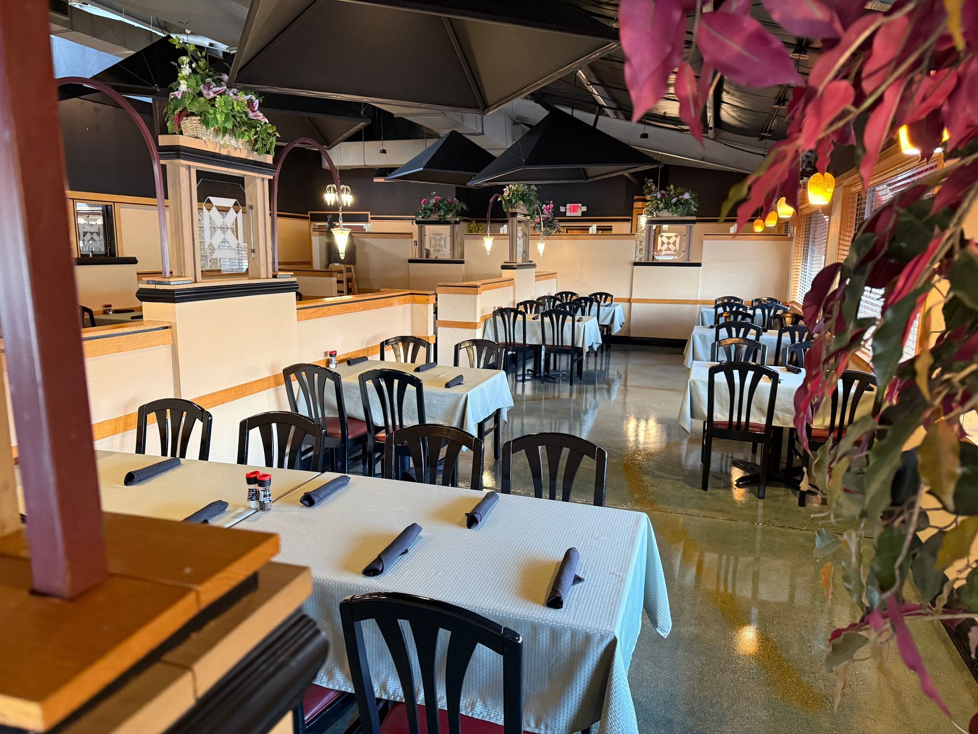 A restaurant with tables and chairs set up for a party
