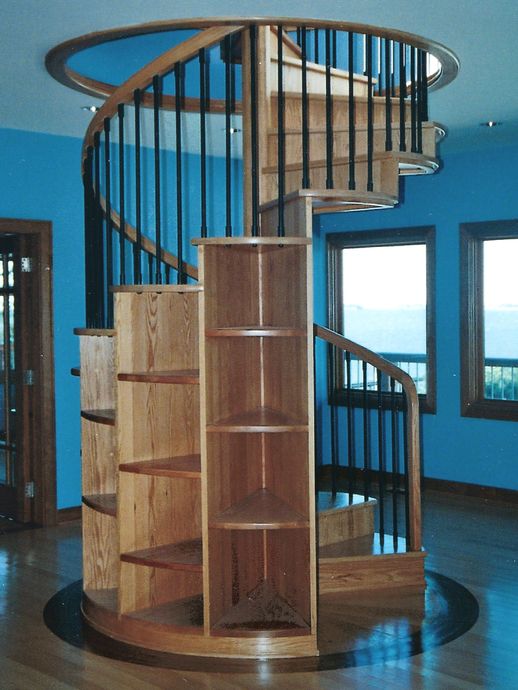 A winder staircase with built in shelving