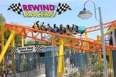 Window Tinting Service-A roller coaster called rewind racers with people riding it