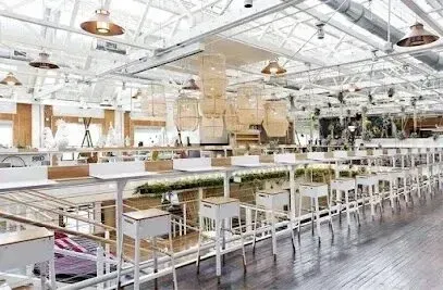 Window Tinting Service-A large room with a lot of tables and chairs in it.