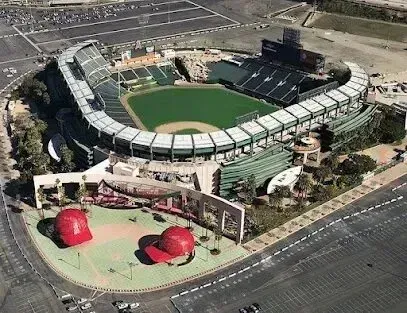 Window Tinting Service-An aerial view of a baseball stadium with two large red hats on the field.