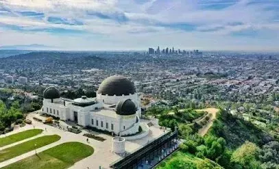 Window Tinting Service-An aerial view of the griffith observatory in los angeles with a city in the background.