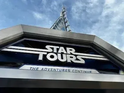 Window Tinting Service-A close up of a star tours sign with a blue sky in the background.