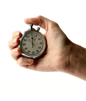 hand holding a stopwatch