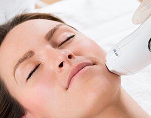 Beautician Giving Laser Epilation Treatment To Woman Face - Laser Hair Removal in Hills, NY
