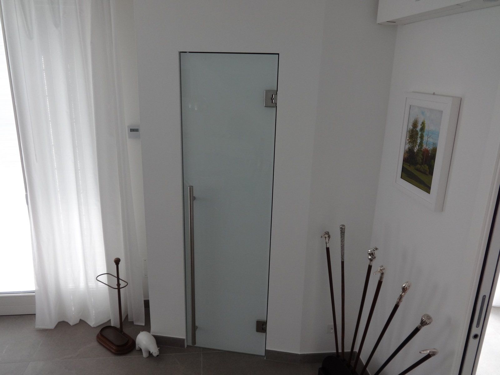 porta battente in vetro camera
