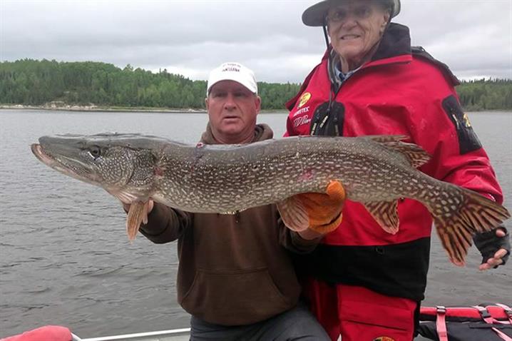 Fisherman at Oak lake Lodge in Canada holding a 44.5