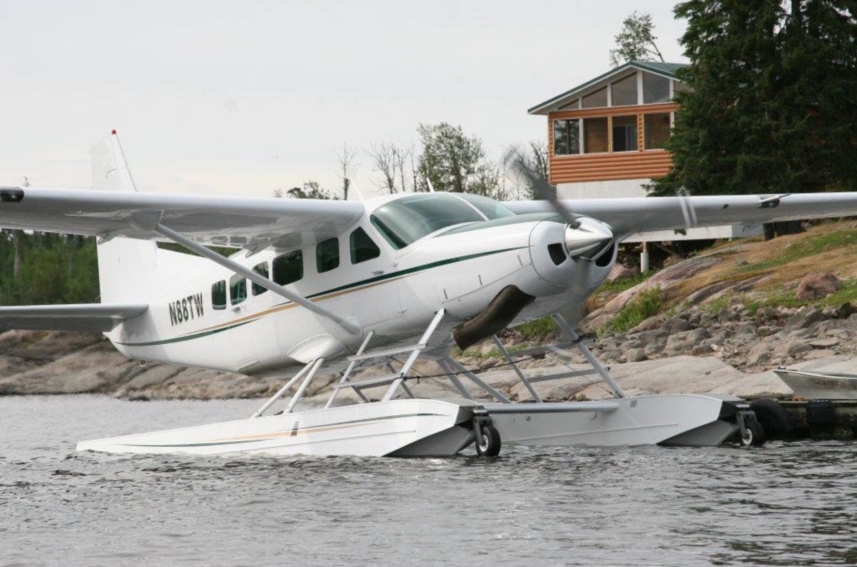 A privately owned float plane docked at Oak Lake Lodge