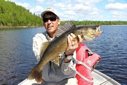 Brad K. holding up a fish at Oak Lake Lodge.