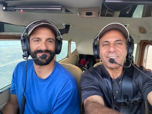David, a guide and pilot, with his father John in David's plane at Oak Lake Lodge. 