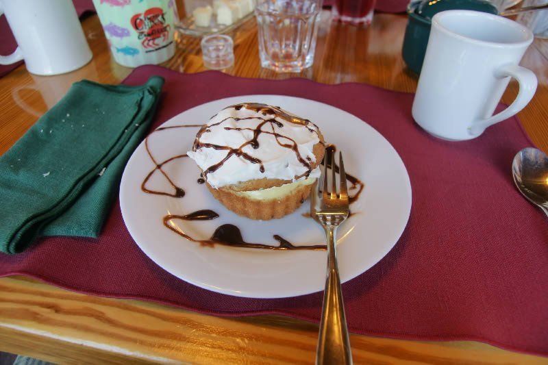 A dessert on a plate with a fork on a table