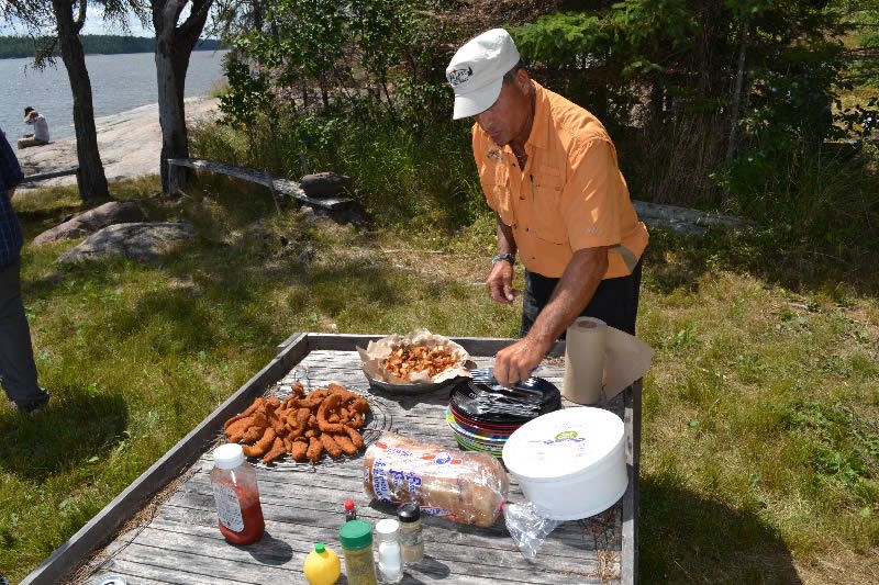 Getting the fish-fry shore lunch prepared.