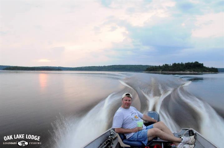 Man boating during his fly-in fishing trip to Canada.
