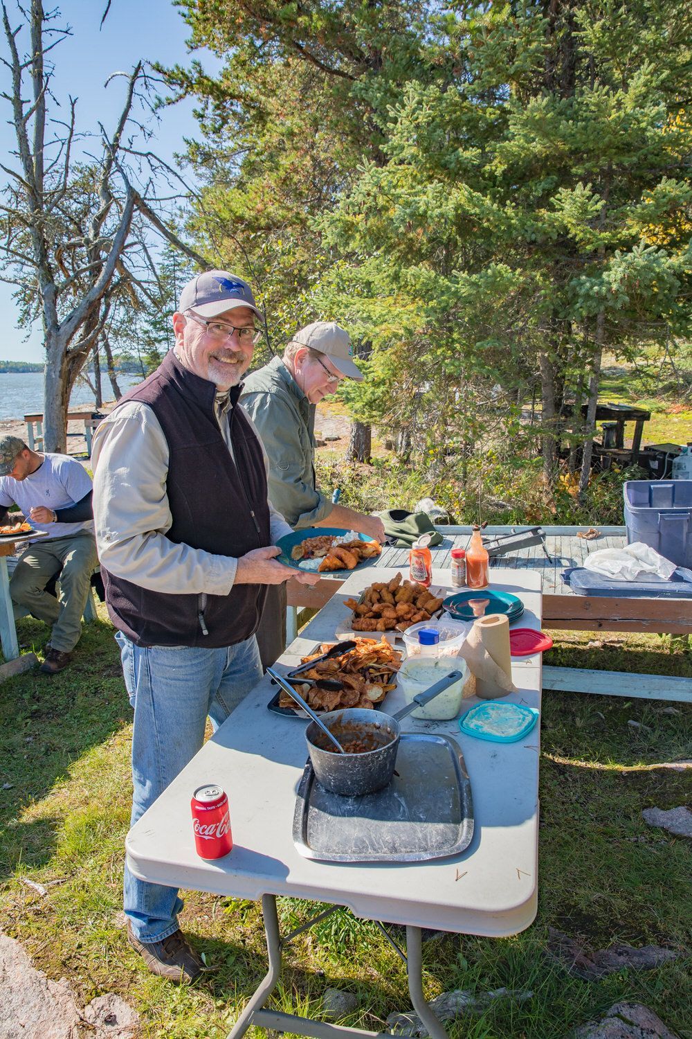 Your fishing guide prepare a shore lunch of walleye at  Oak Lake Lodge's American Plan Fly-in fishing lodge in Ontario, Canada.