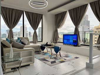 A living room with a couch , table , and television.