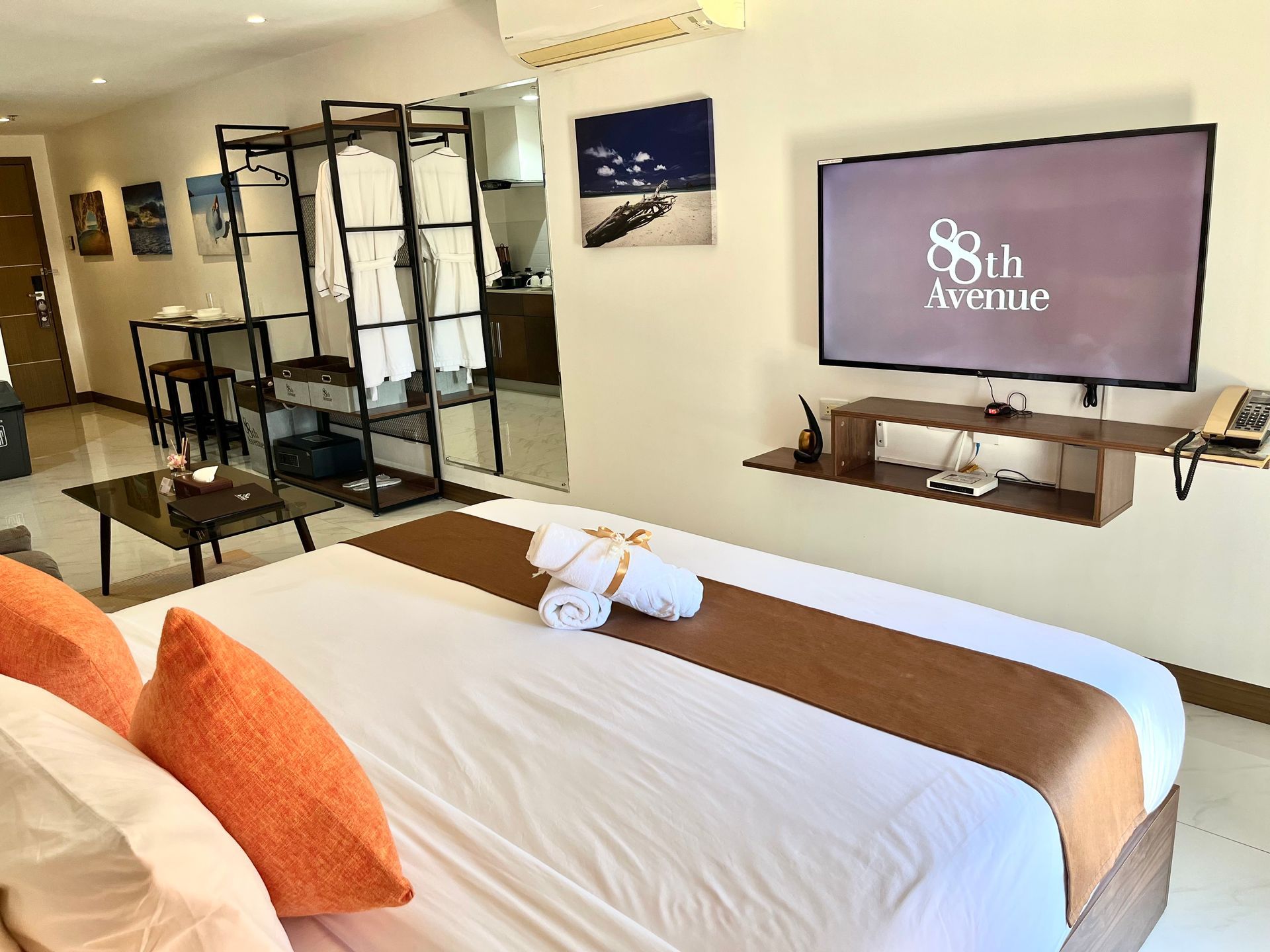 There is a dining table and chairs in the middle of the room.