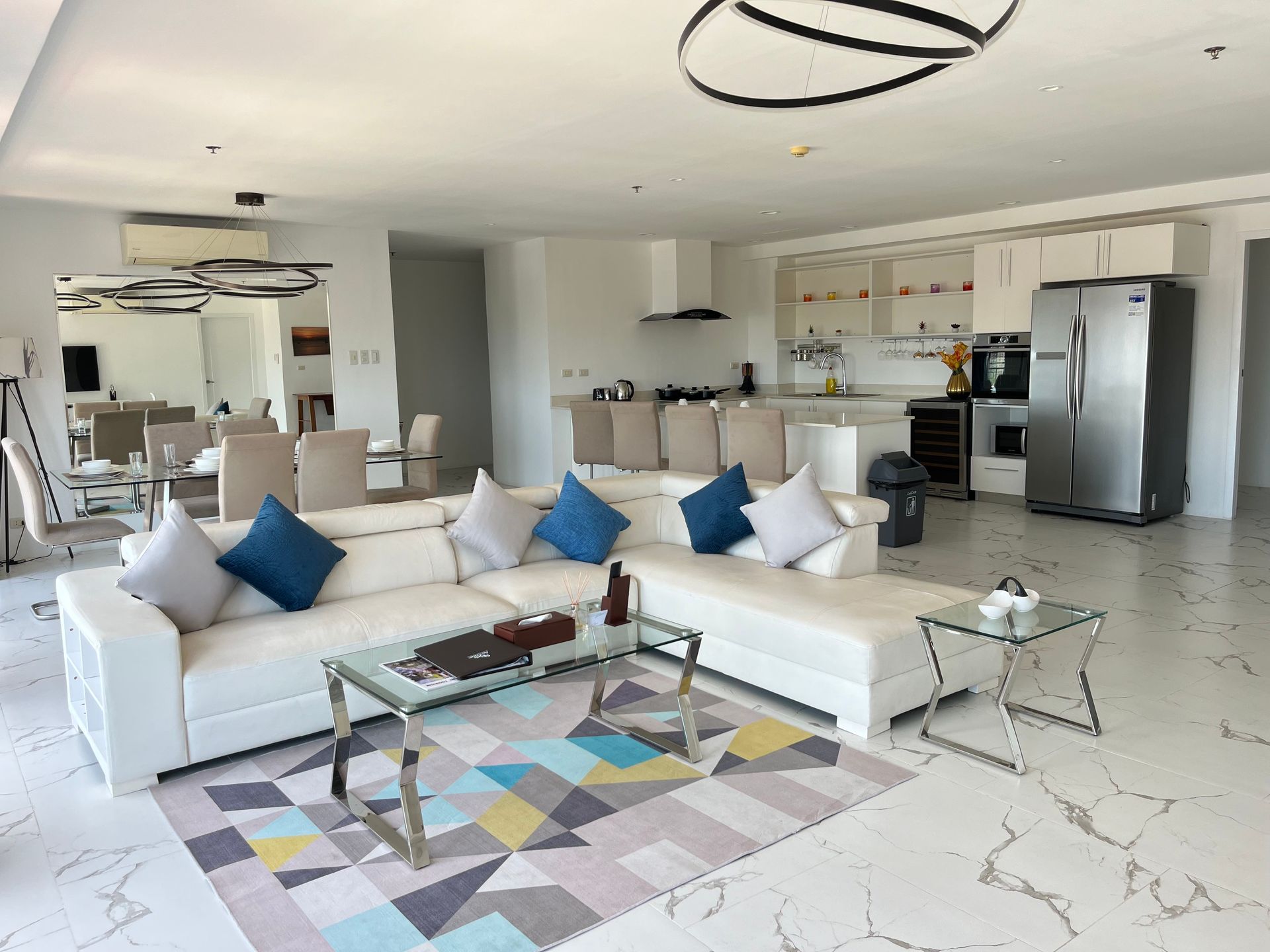 A living room with a couch , table , and television.
