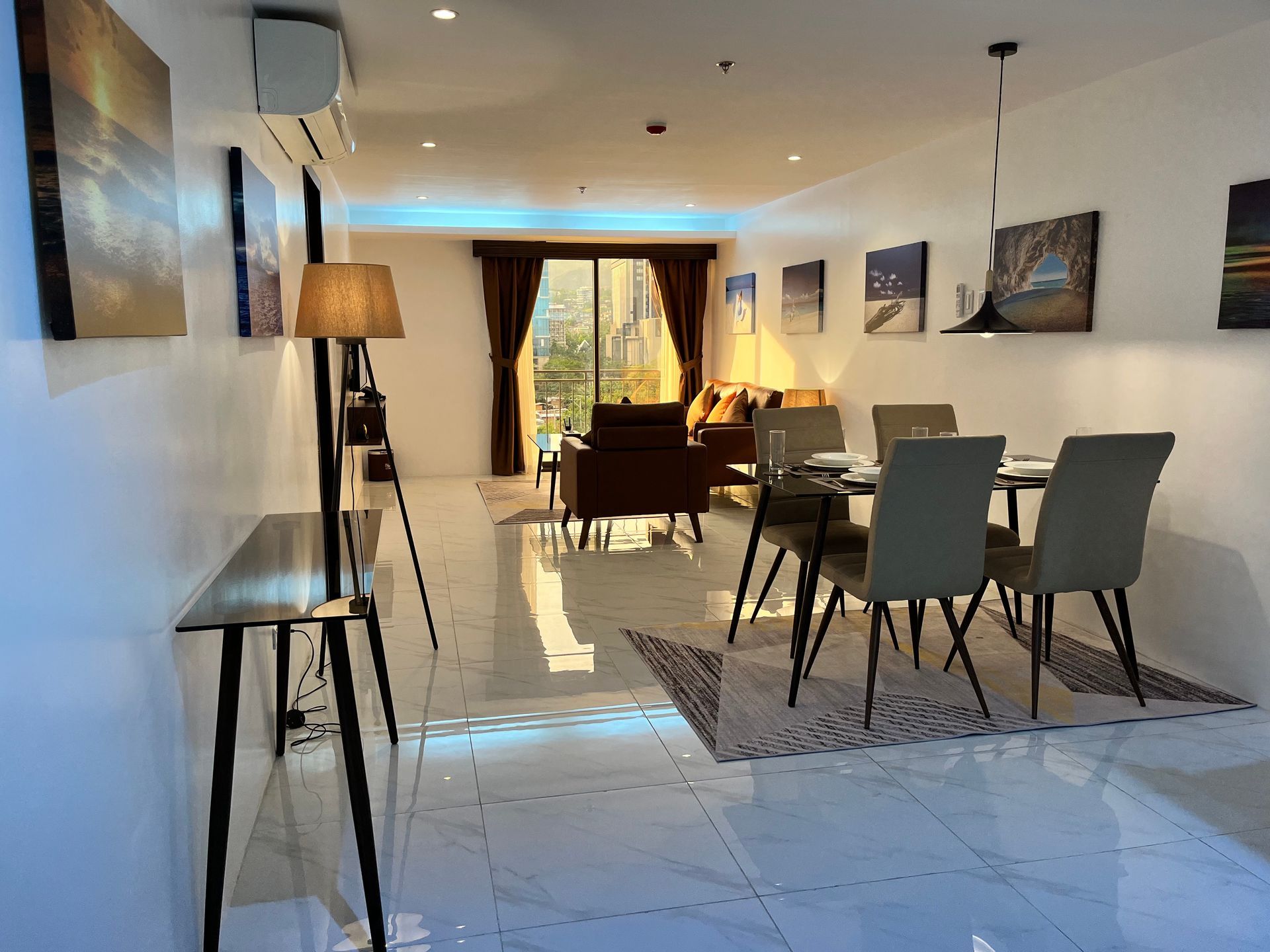 A living room with a dining table and chairs