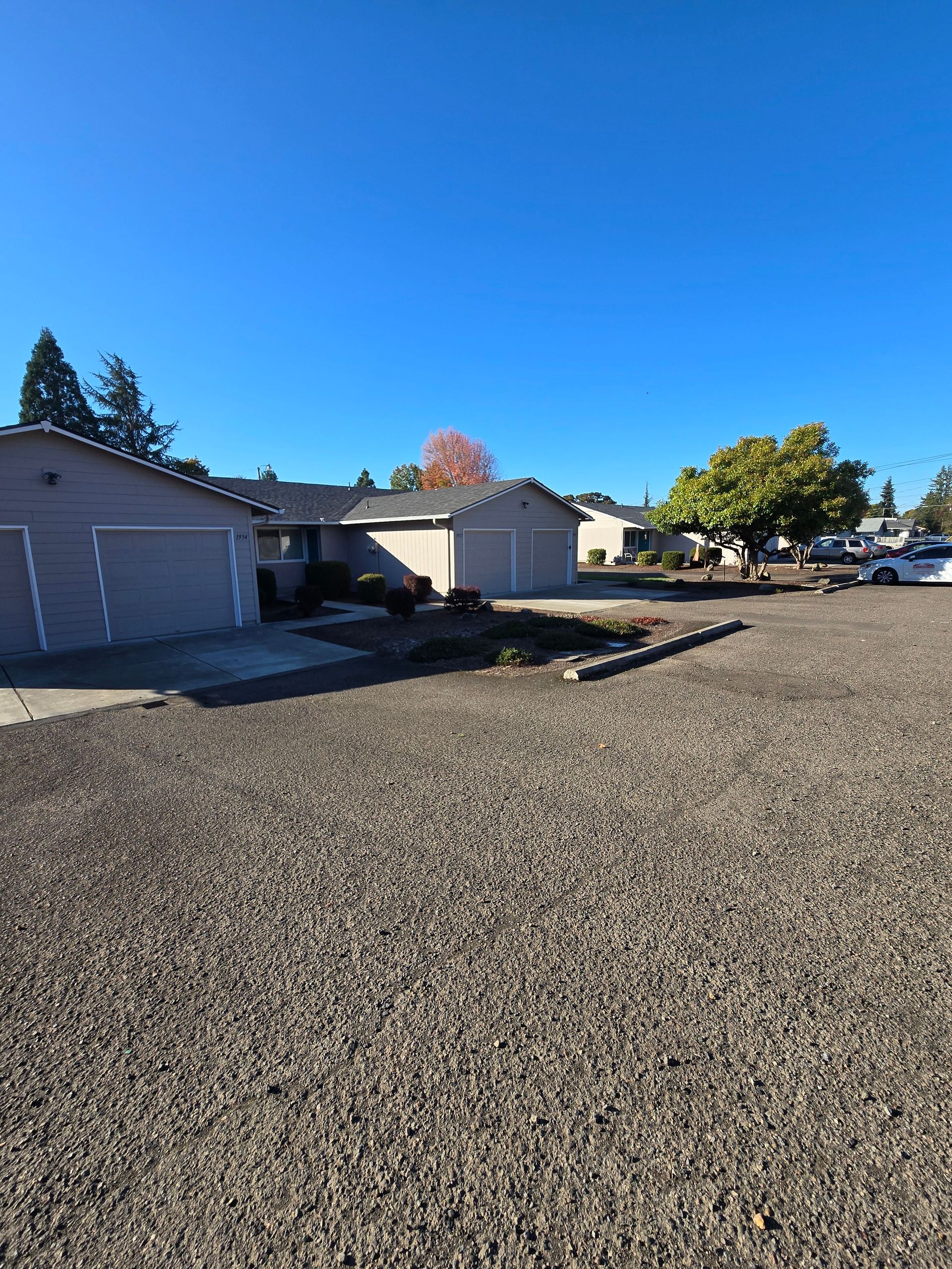 Jackson Duplexes in Albany Oregon – front exterior, garage and tree.