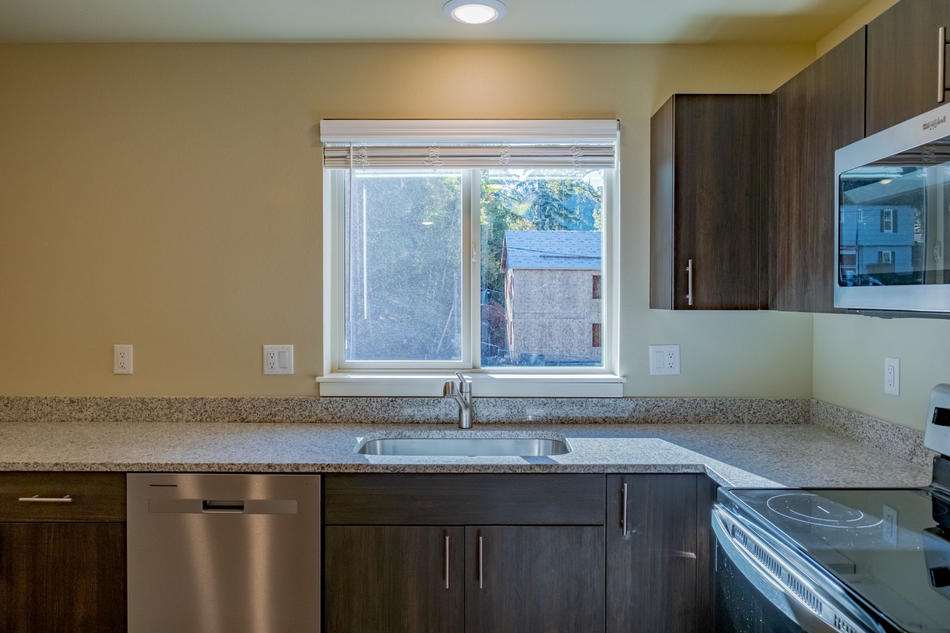 Harmona Heights Apartment community in South Salem Oregon, two-bedroom two-bathroom – kitchen, dishwasher and kitchen window.