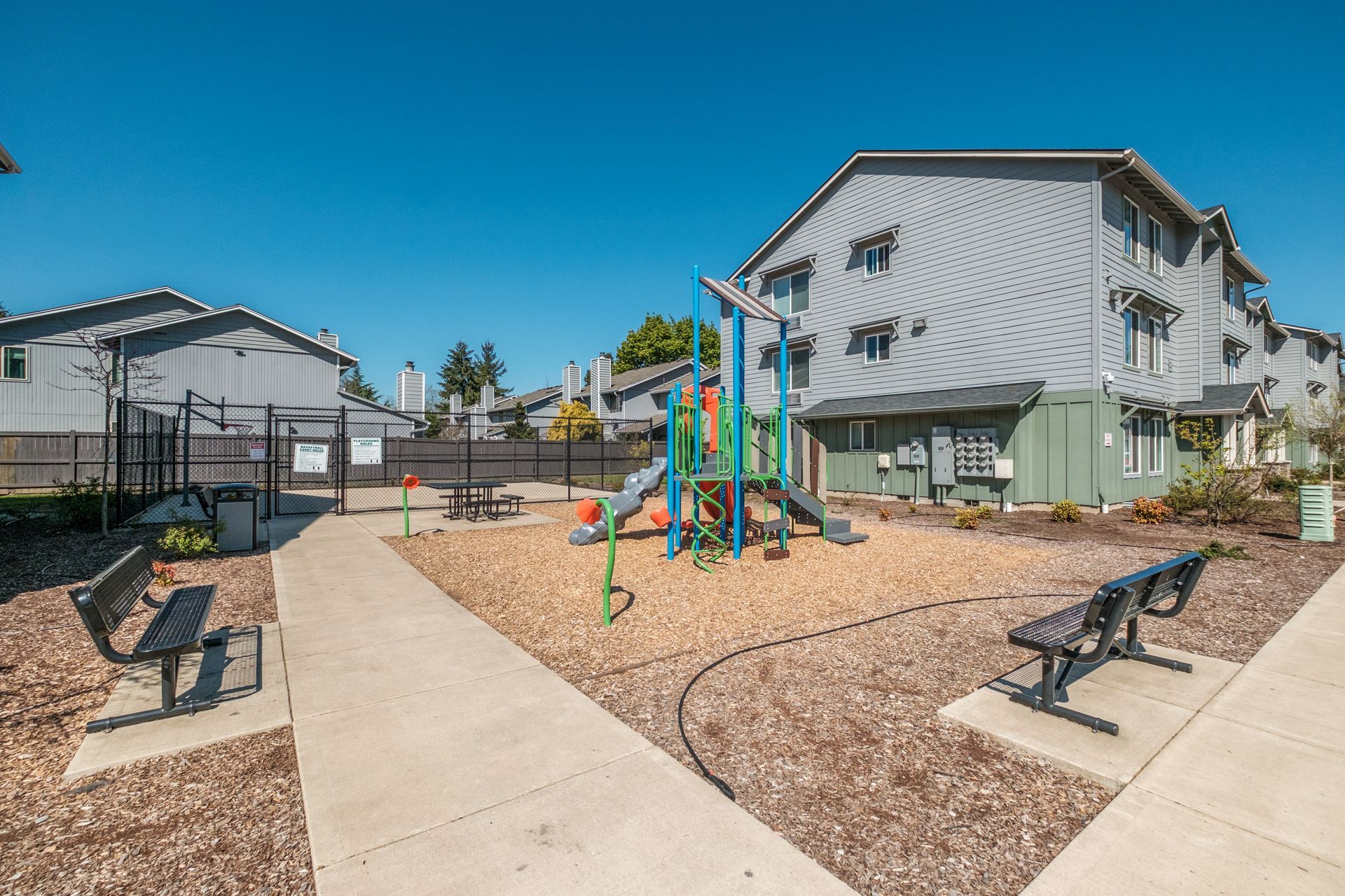 Cherry Glen Apartments in Salem Oregon – playground and surrounding benches.