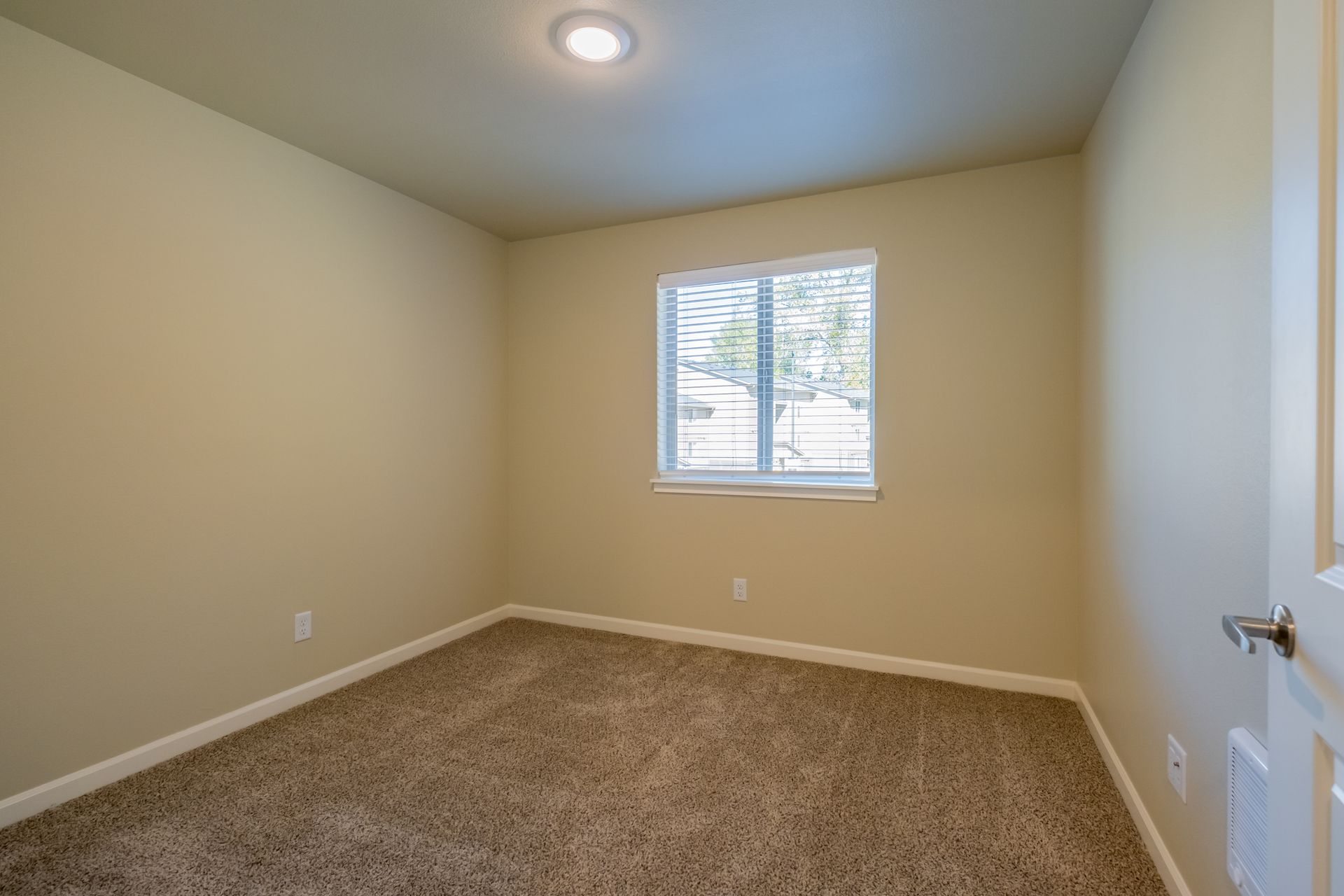 Harmona Heights Apartment community in South Salem Oregon, two-bedroom two-bathroom – bedroom and window -2.