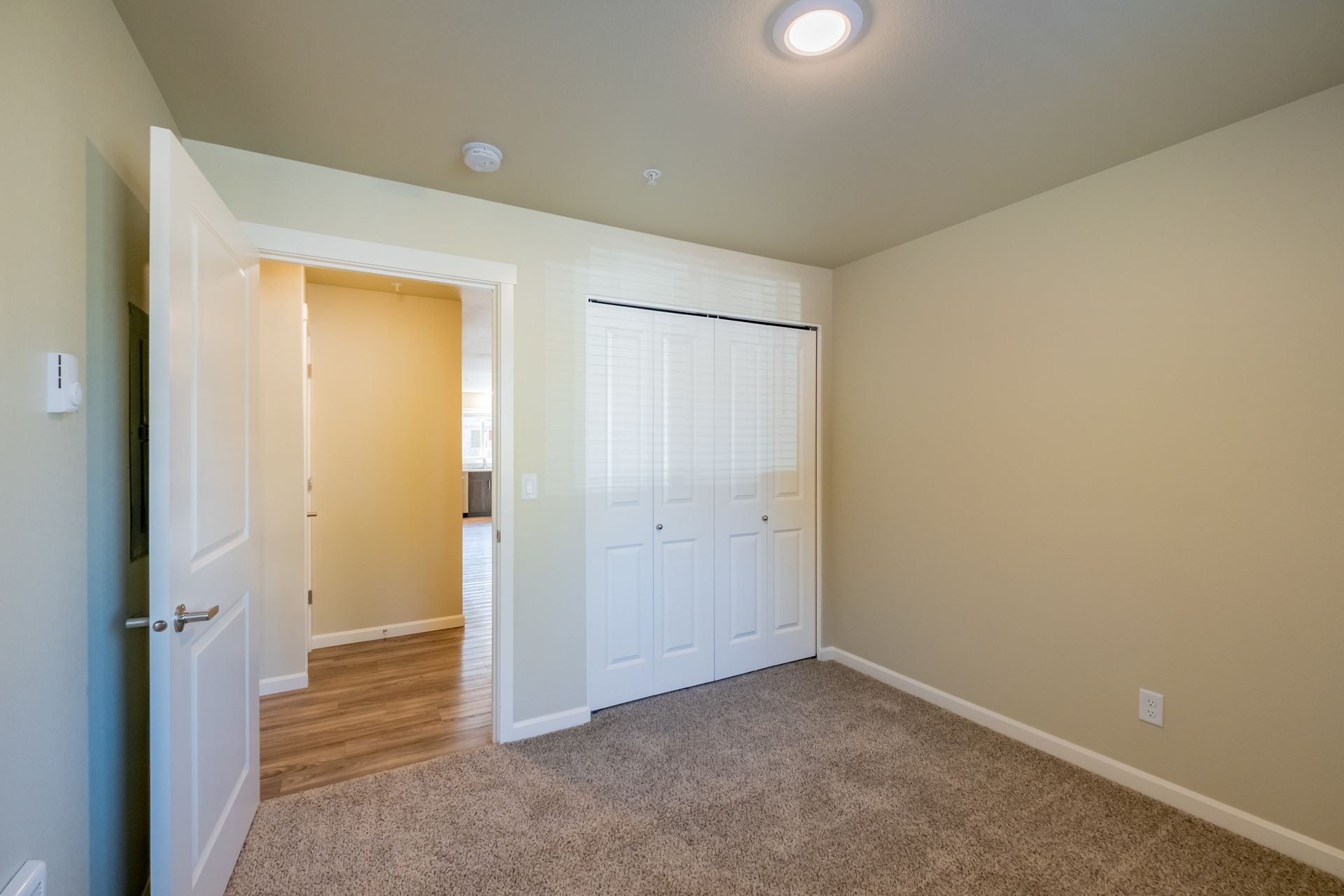 Harmona Heights Apartment community in South Salem Oregon, two-bedroom two-bathroom – bedroom, door and closet -2.