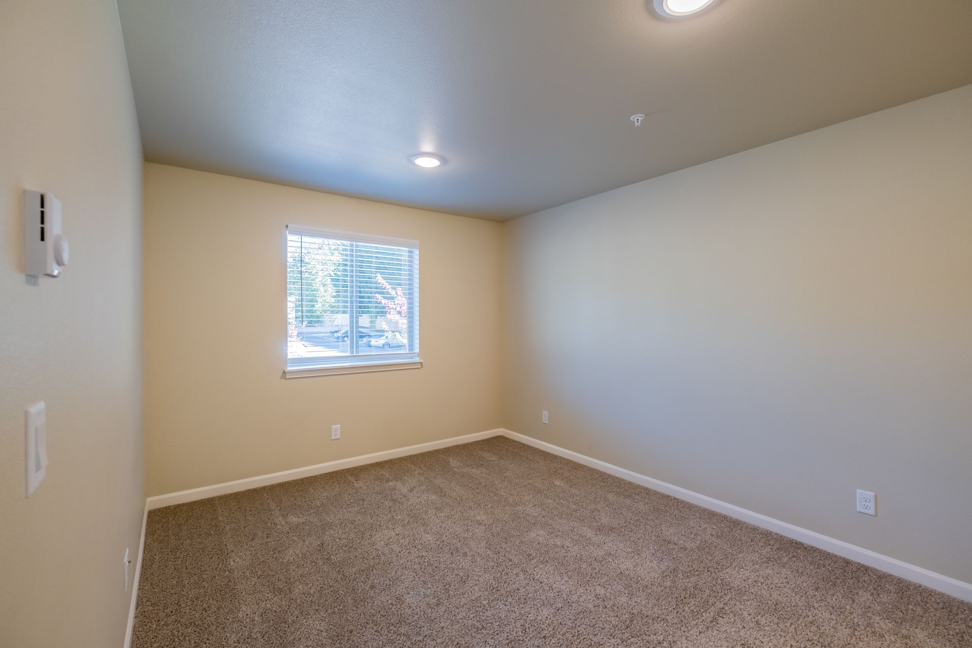 Harmona Heights Apartment community in South Salem Oregon, two-bedroom two-bathroom – master bedroom window.