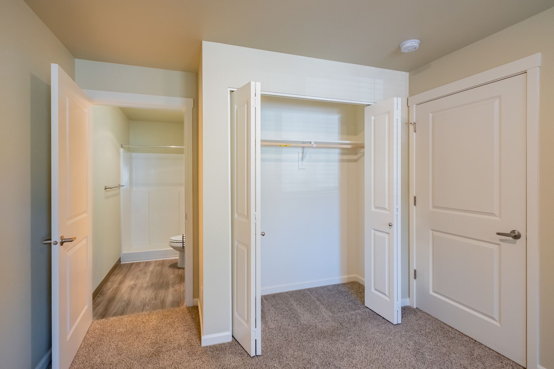 Harmona Heights Apartment community in South Salem Oregon, two-bedroom two-bathroom – master bathroom and bedroom closet.
