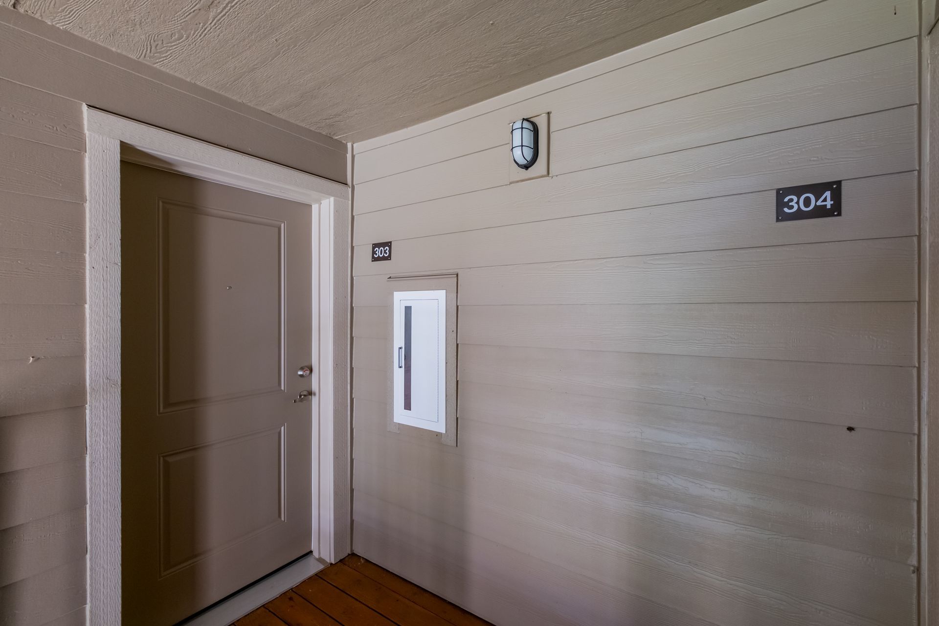 Harmona Heights Apartment community in South Salem Oregon, one-bedroom one-bathroom – front door and fire extinguisher.