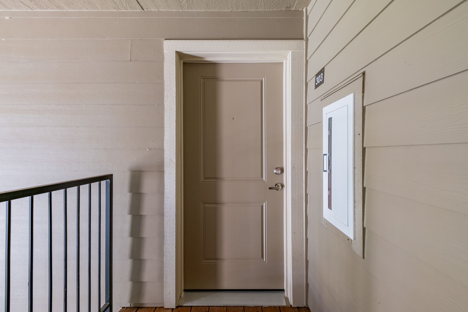 Harmona Heights Apartment community in South Salem Oregon, one-bedroom one-bathroom – front door and railing.