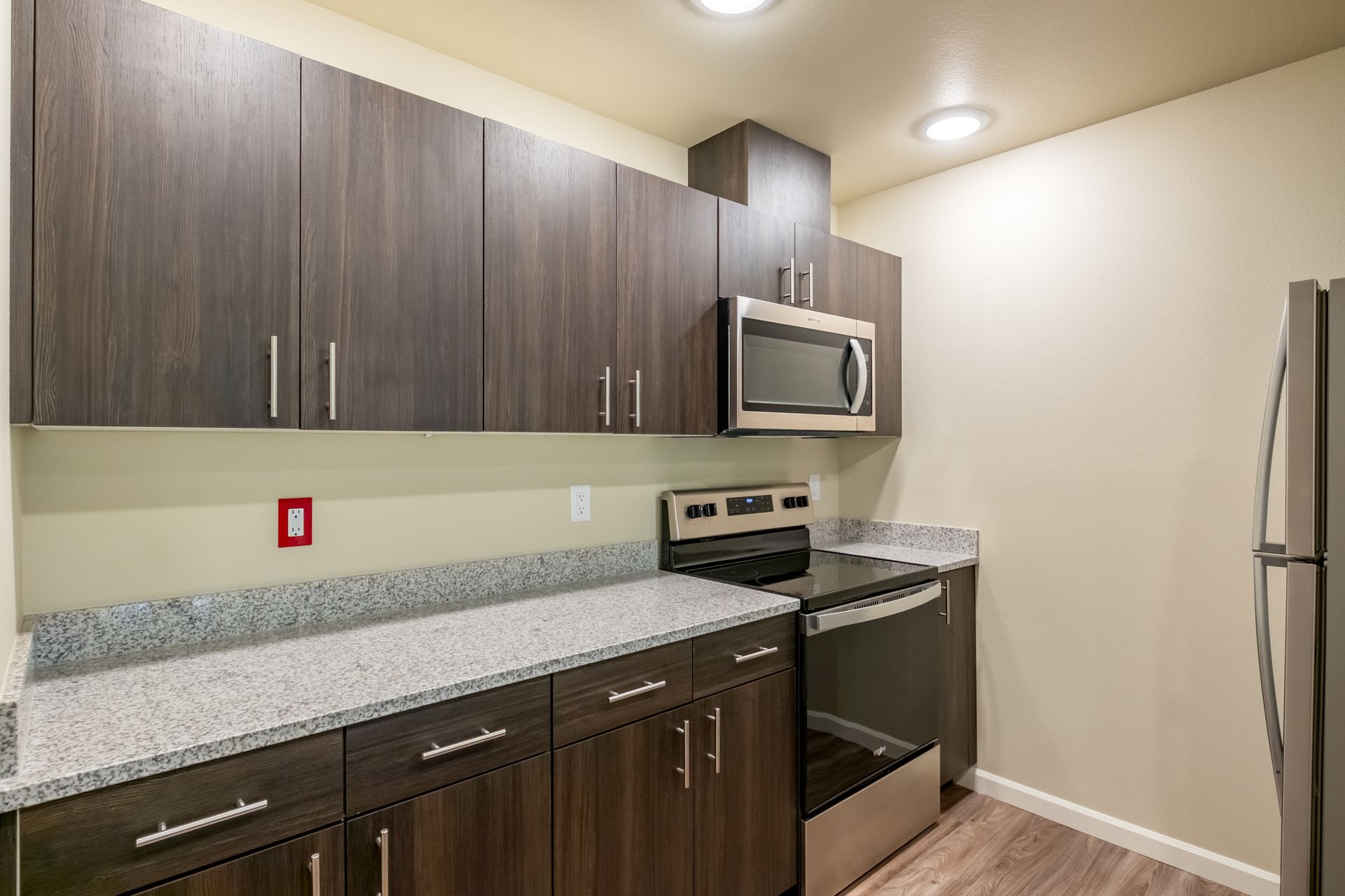 Harmona Heights Apartment community in South Salem Oregon, one-bedroom one-bathroom – kitchen, stove microwave, cabinetry.