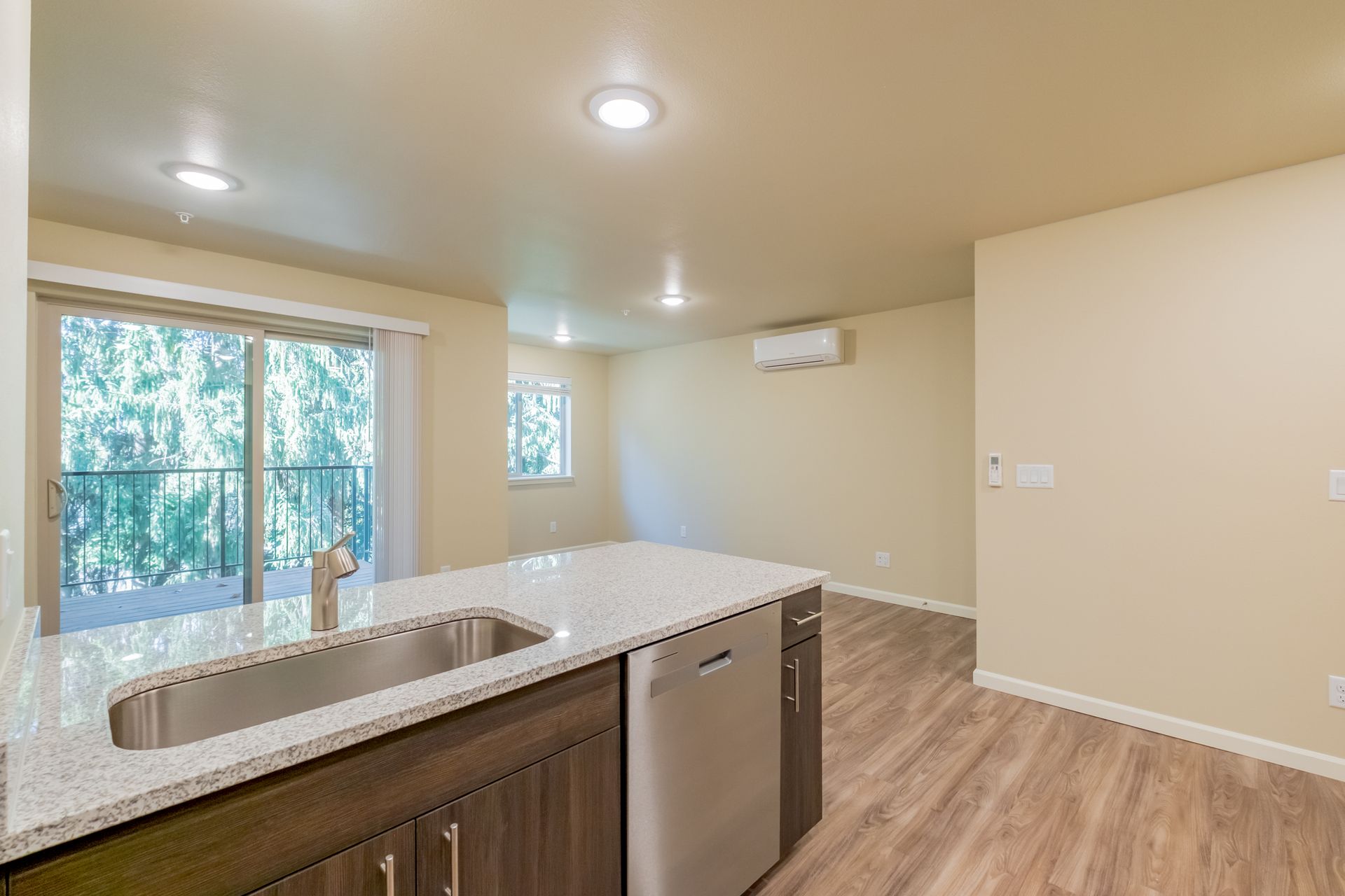 Harmona Heights Apartment community in South Salem Oregon, one-bedroom one-bathroom – kitchen sink and sliding glass door.