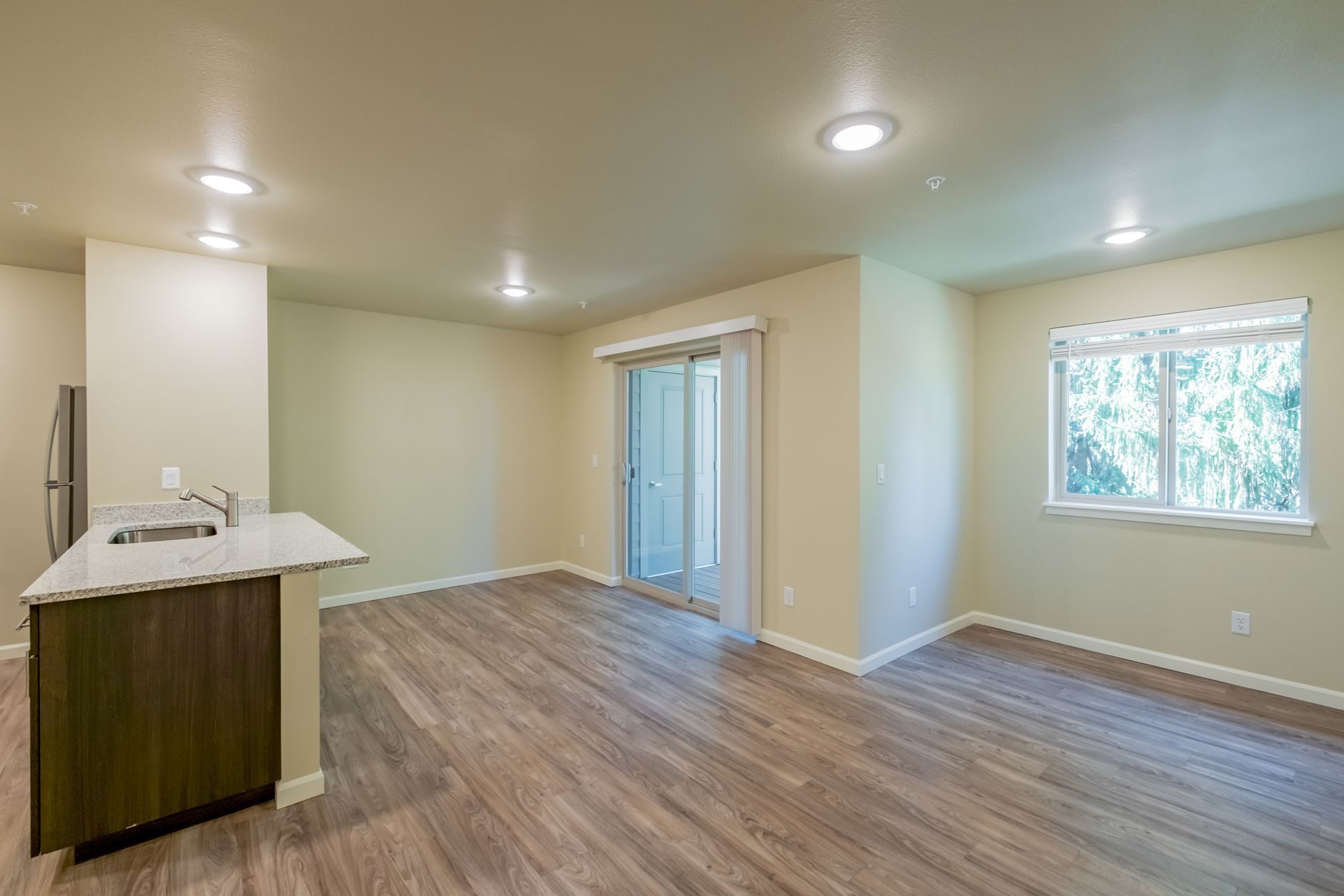 Harmona Heights Apartment community in South Salem Oregon, one-bedroom one-bathroom – kitchen sink, living room, dining room.