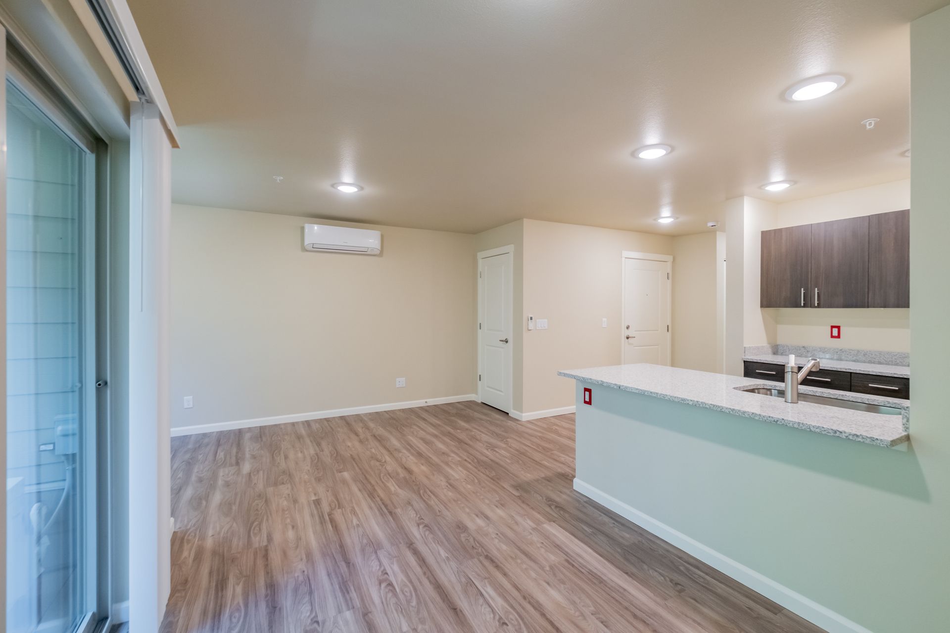 Harmona Heights Apartment community in South Salem Oregon, one-bedroom one-bathroom – living room and heater and AC.