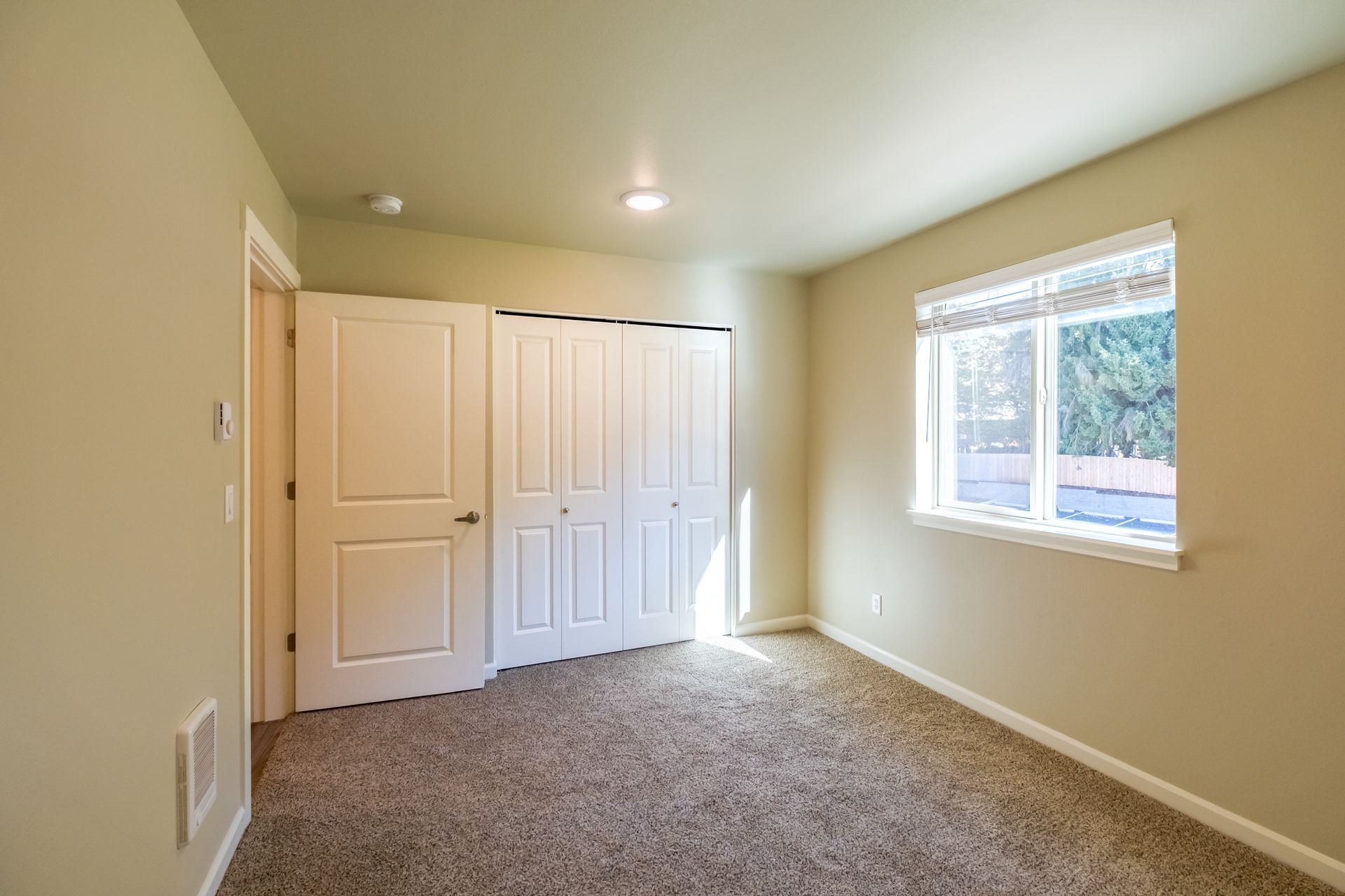Harmona Heights Apartment community in South Salem Oregon, one-bedroom one-bathroom – bedroom and window -1.