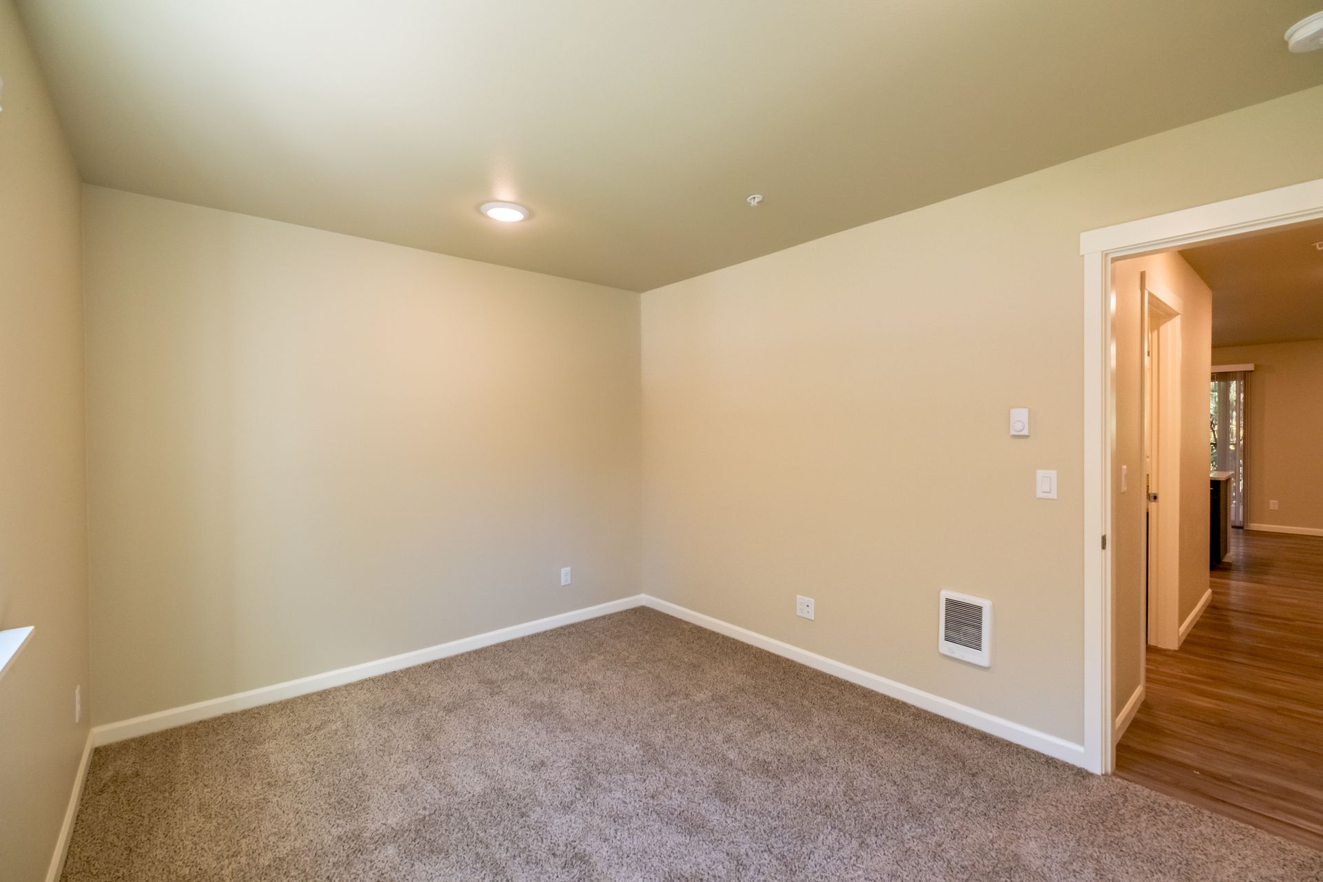Harmona Heights Apartment community in South Salem Oregon, one-bedroom one-bathroom – bedroom 1 and door.