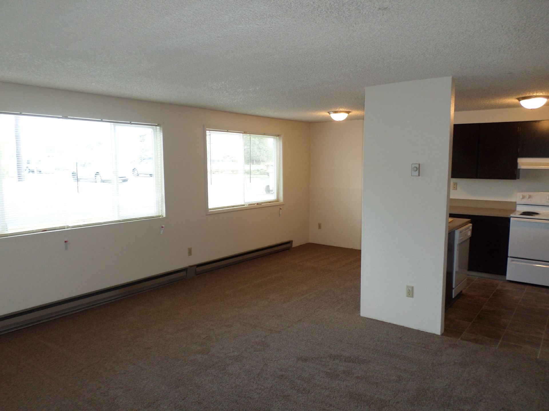 1061 Washington Apartments in Corvallis OR, Near Oregon State University, two-bedroom two-bathroom – living room and windows.