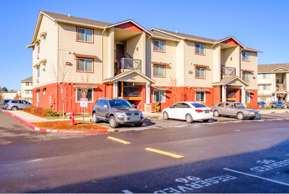 Lafayette Place Apartments in McMinnville, Oregon, near Linfield University – apartment home community buildings and parking.