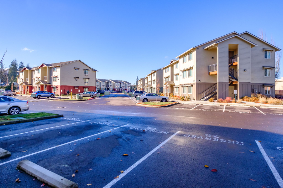Lafayette Place Apartments in McMinnville, Oregon, near Linfield University – apartment home community and parking lot.