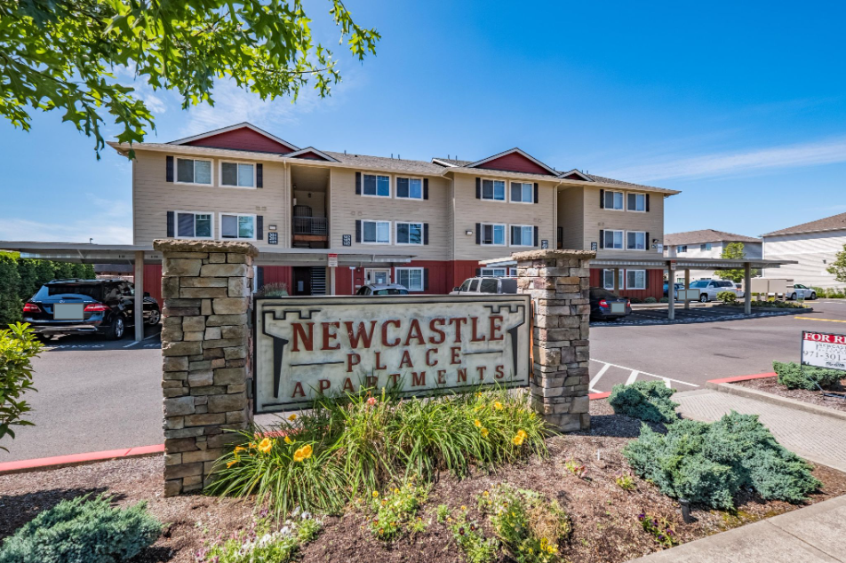 Newcastle Place Apartments in Salem Oregon, Near Chemeketa Community College -sign and apartment community.