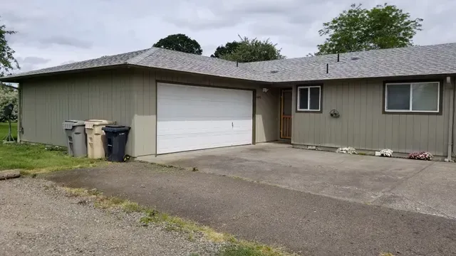Amanda Lane Duplexes in Millersburg Oregon – gray duplex home and garage.