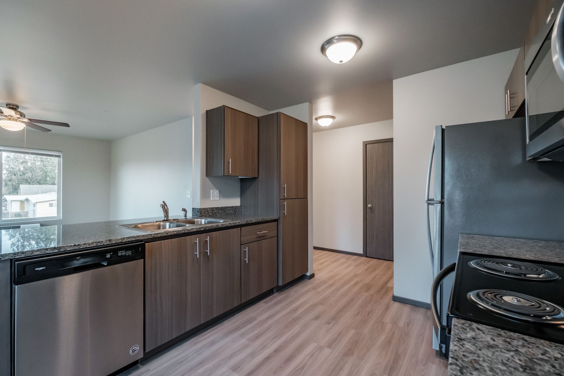 Cherry Glen Apartments in Salem Oregon – two-bedroom two-bathroom apartment home kitchen - long photo.
