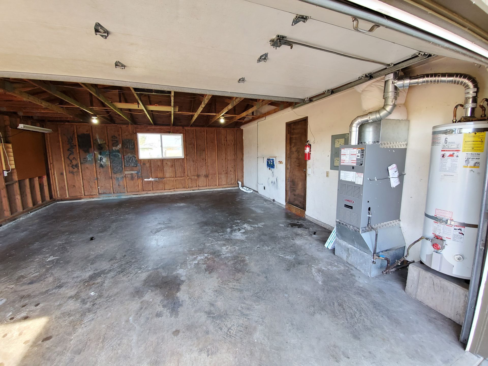 Amanda Lane Duplexes in Millersburg Oregon, three-bedroom two-bathroom – water heater and H-VAC in garage.