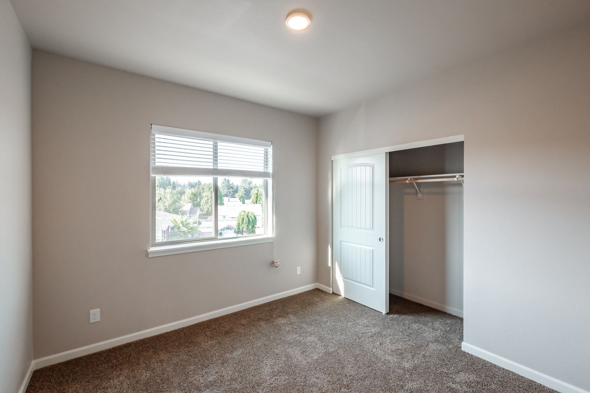 Hickory Hollow Apartments in North Albany OR, three-bedroom two-bathroom –bedroom window and closet -3.