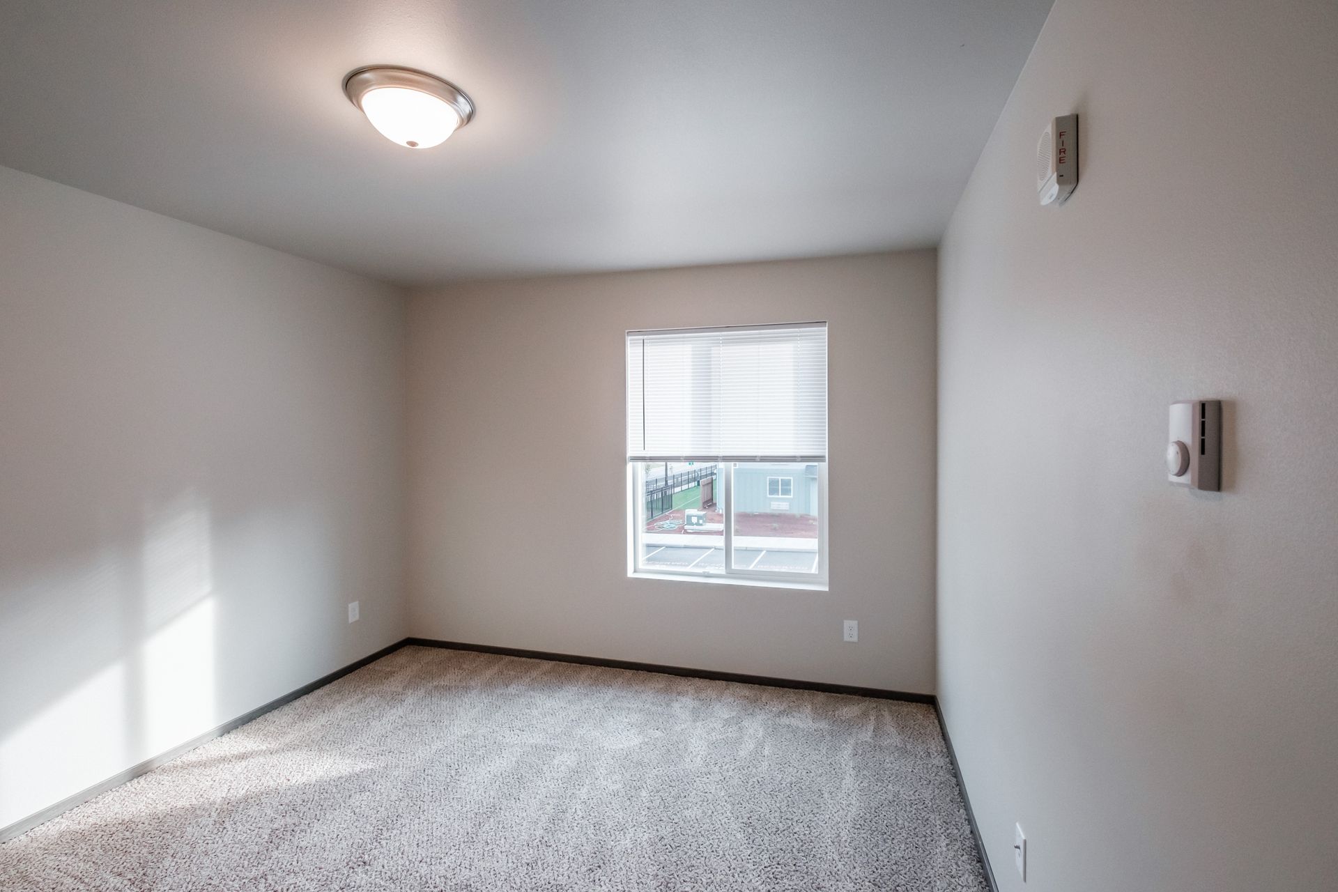 Cherry Glen Apartments in Salem Oregon – two-bedroom two-bathroom apartment home bedroom and window.