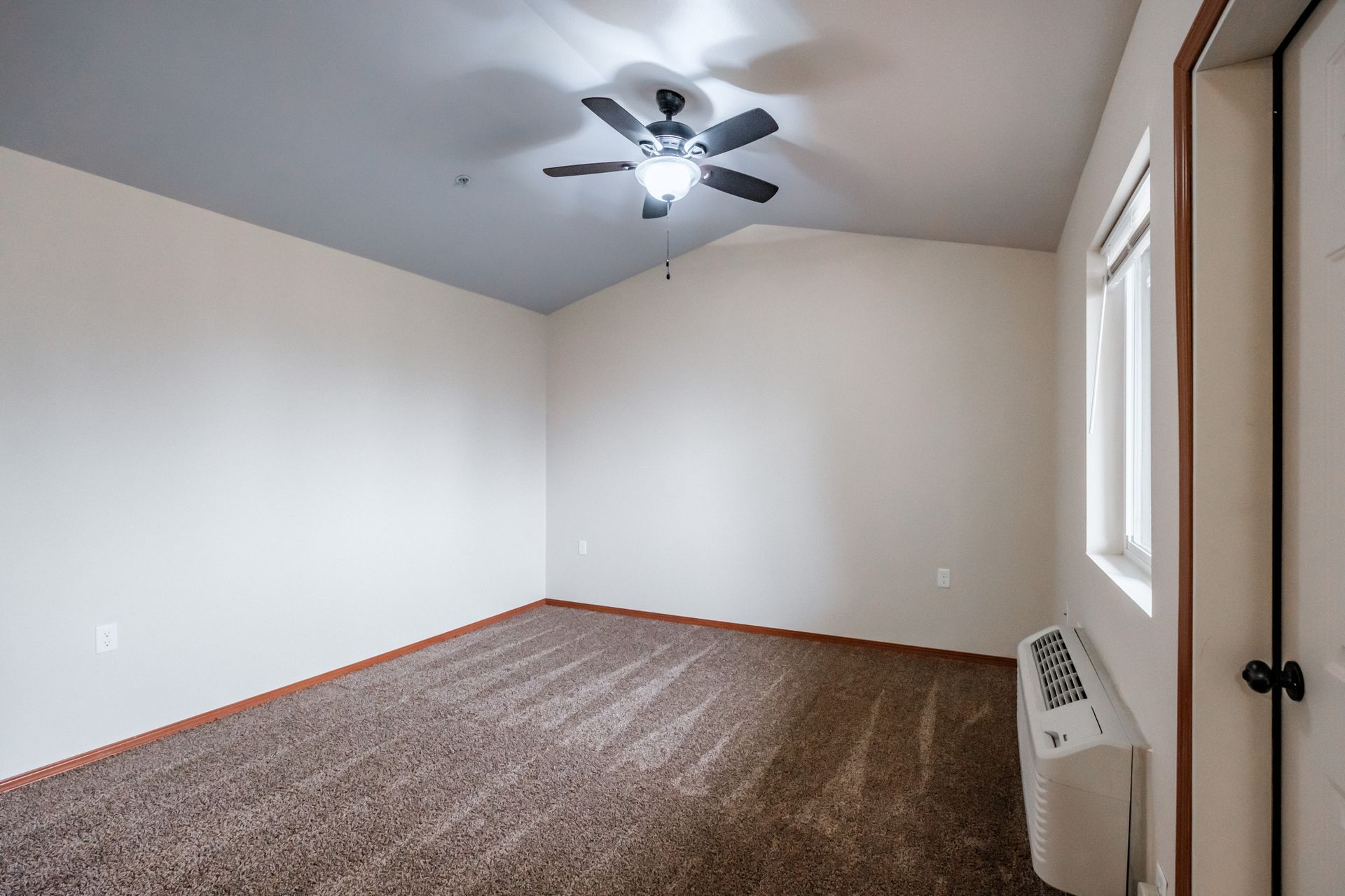 Aspen Place Apartments in Lebanon OR, near Western University of Health Sciences, two-bed two-bath – living room, heater, AC.