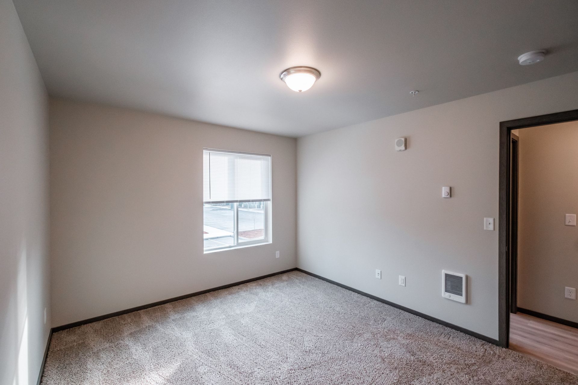 Cherry Glen Apartments in Salem Oregon – two-bedroom two-bathroom apartment home bedroom and door.